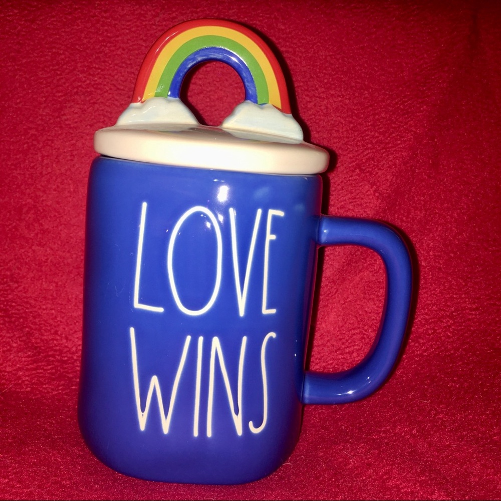 Rae Dunn blue “Love Wins” ceramic 19.5 oz mug with rainbow lid.